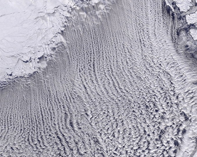 A satellite image of cloud patterns formed by a sea blast of cold air.